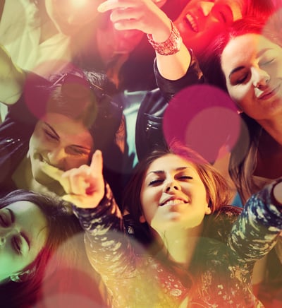 Group of young people having fun dancing at party