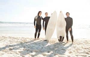 Wearing ear plugs and drying your ears after surfing to reduce the risk of Surfer's Ear.