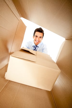 Businessman getting a special delivery and smiling