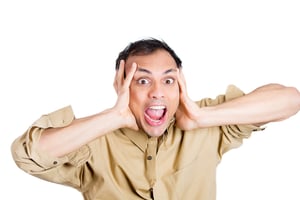 Closeup portrait of young man, worker holding hands to ears covering to shut out noise, looking stressed and pushed to limit, isolated on white background . Negative Human emotion facial expressions