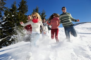 happy friends have fun at winter on fresh snow, healthy young people group outdoor