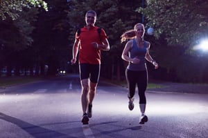 urban sports, healthy couple jogging in the city at early morning in night