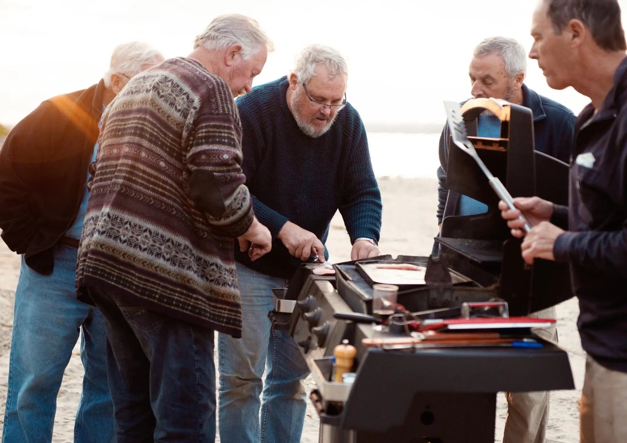 older men around a bbq